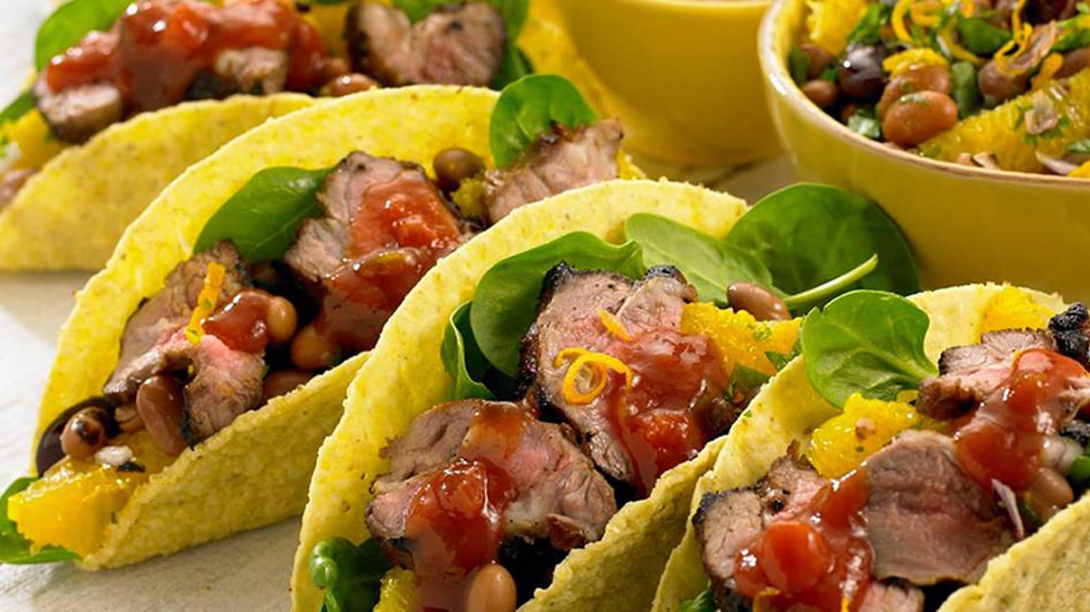 lamb tacos with orange and beans